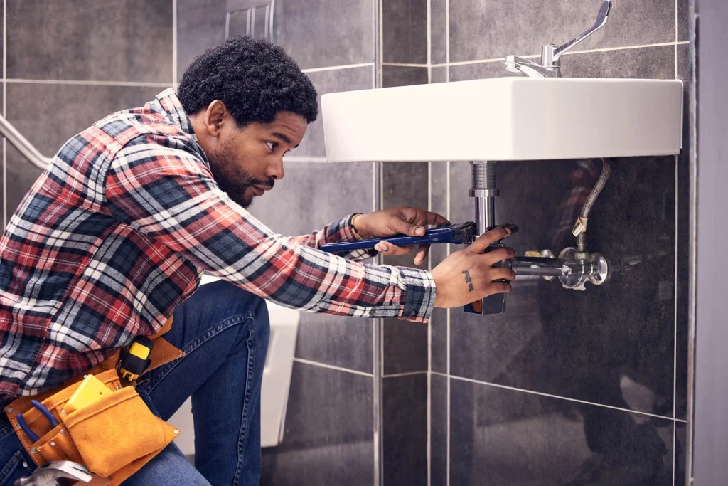 Man fixing a drain
